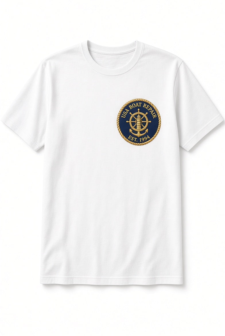 USA Boat Repair white t-shirt with gold embroidered nautical patch on navy background on left chest
