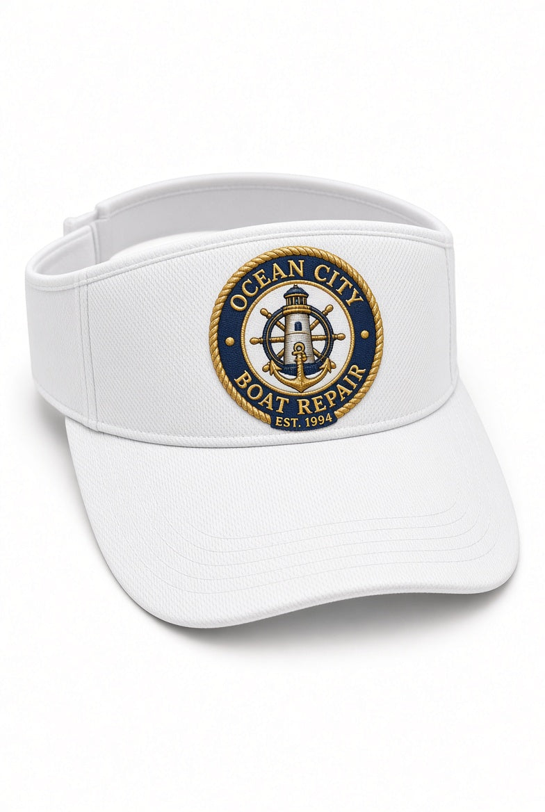 White Ocean City Boat Repair visor with embroidered navy and gold lighthouse and anchor crest