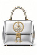 Miami Boat Repair Silver Top Handle Bag with gold rope handle and anchor clasp