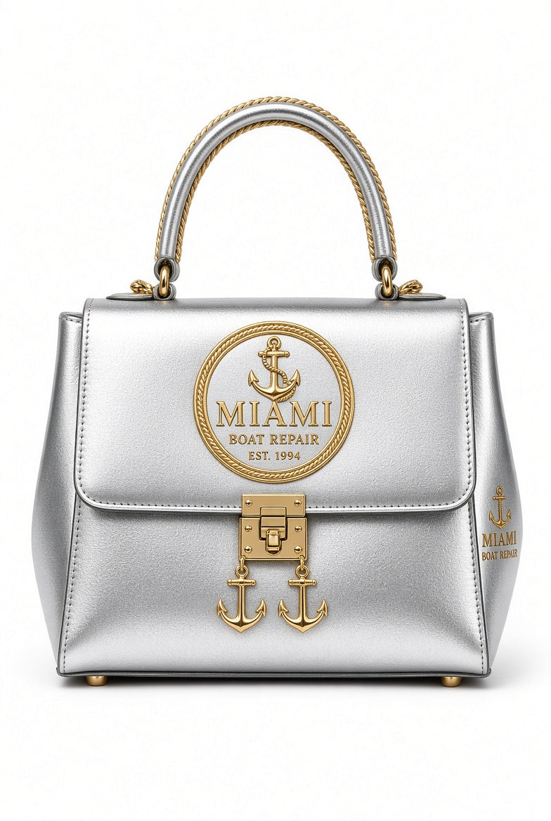 Miami Boat Repair Silver Top Handle Bag with gold rope handle and anchor clasp