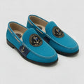 Annapolis Yacht Club turquoise leather nautical loafer with navy trim and gold anchor medallion crest and silver anchor charm