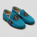Jersey Shore Yacht Club turquoise leather nautical loafer with navy trim and gold ship's wheel anchor medallion crest and silver anchor charm