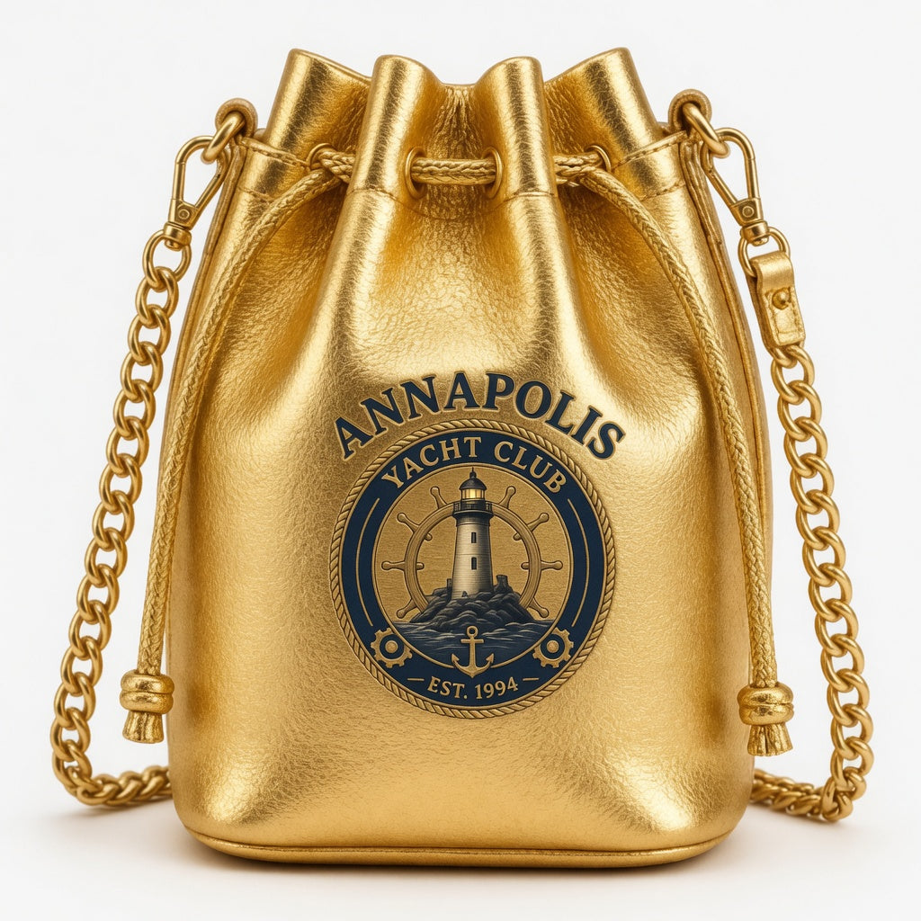 Gold metallic bucket bag with Annapolis Yacht Club nautical medallion and chain strap