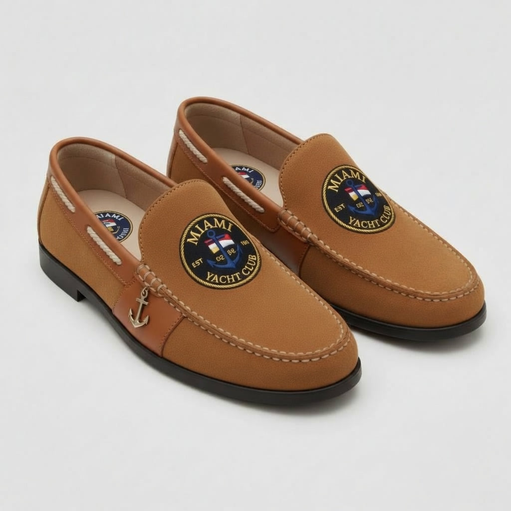Miami Yacht Club tan suede nautical loafer with cognac trim and navy gold nautical flag medallion crest and gold anchor charm