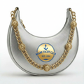 Miami Yacht Club silver metallic crescent hobo bag with navy and gold anchor crest Est. 1994 and gold chain strap with lion head medallion charms