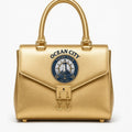 Ocean City Yacht Club gold metallic structured handbag with anchor charm lock and rope handle