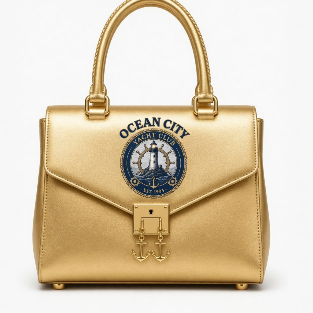 Ocean City Yacht Club gold metallic structured handbag with anchor charm lock and rope handle
